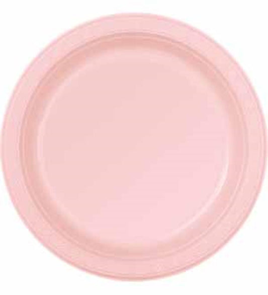 Round pastel pink plastic plate with a slightly raised rim, smooth finish.