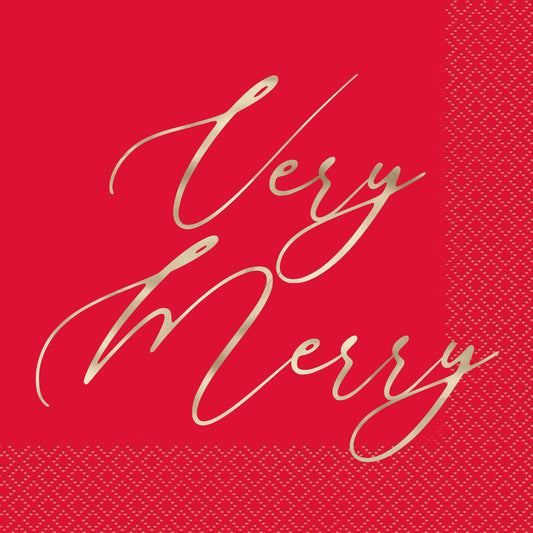 Red luncheon napkin with gold cursive "Very Merry" text and decorative embossed border pattern.
