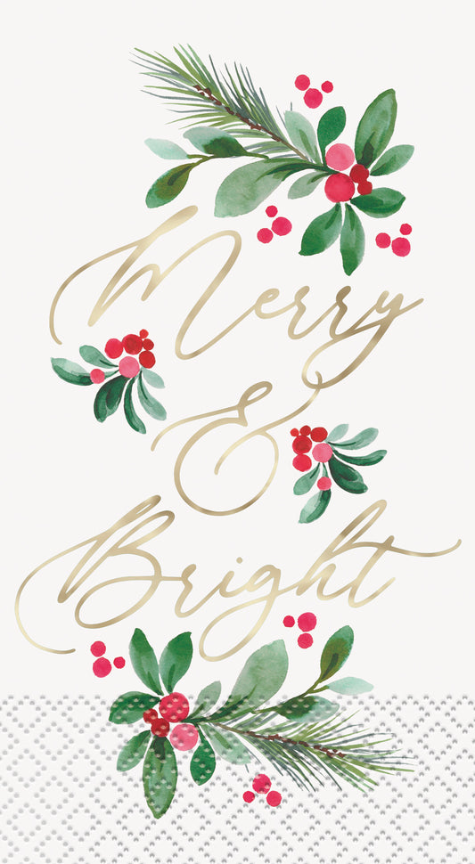 White guest napkins with gold "Merry & Bright" script and green pine branches with red holly berries accents.