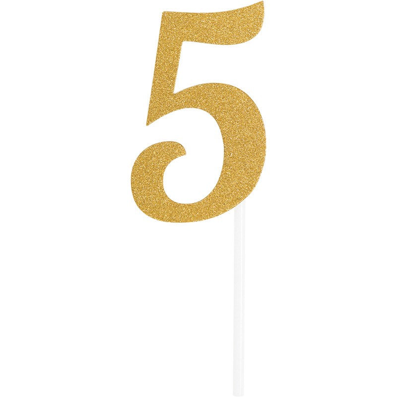 Gold glitter number 5 cake topper with white stick for decoration.