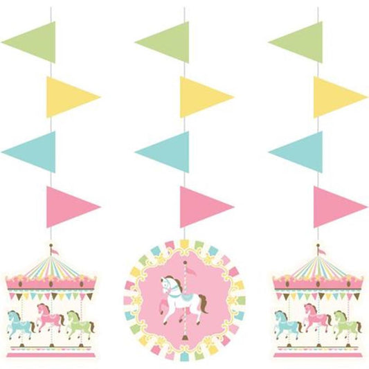 Three hanging carousel-themed cutouts with pastel-colored flags, featuring white carousel horses and a central pink circle.