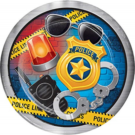 Round kids' party plate with a blue brick background, police badge, sunglasses, handcuffs, walkie-talkie, and police line.