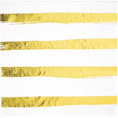 White square luncheon napkin with four horizontal shiny gold foil stripes, three-ply texture.