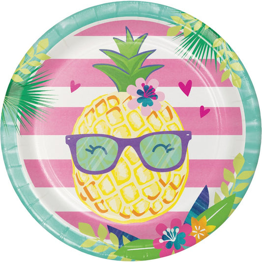 Round paper plate with pink and white horizontal stripes featuring a smiling pineapple wearing teal sunglasses, surrounded.