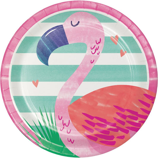 Round paper plate with a pink flamingo over teal and white stripes and green grass accents.