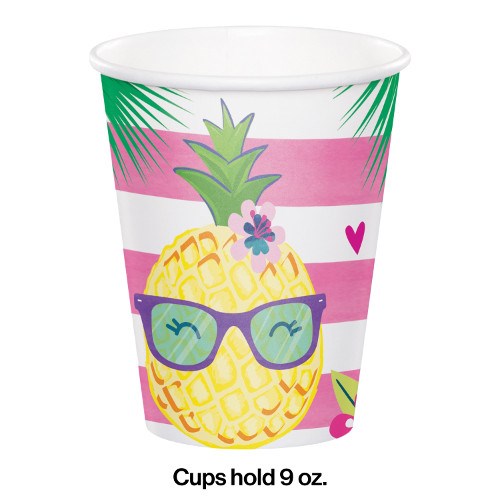 White paper cup with pink stripes featuring a smiling pineapple wearing teal sunglasses and tropical flowers.