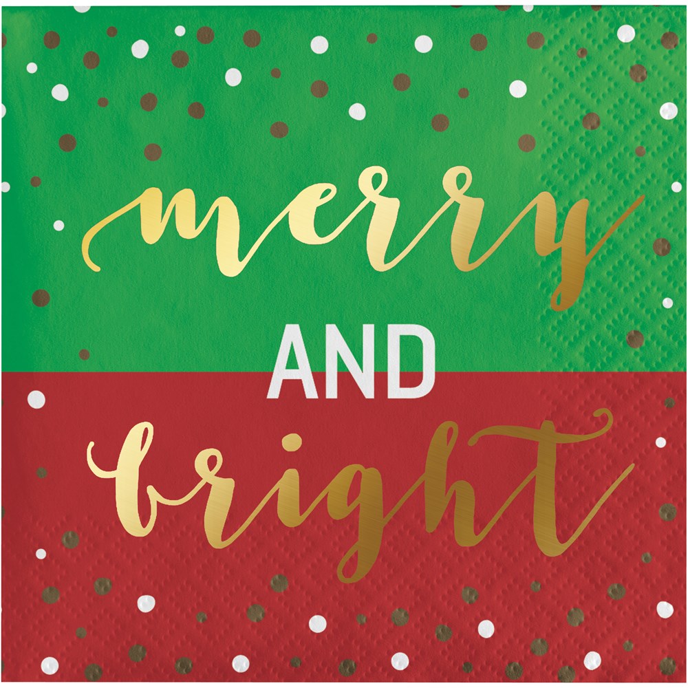 Green and red square beverage napkin with gold and white "merry and bright" lettering and scattered polka dots.