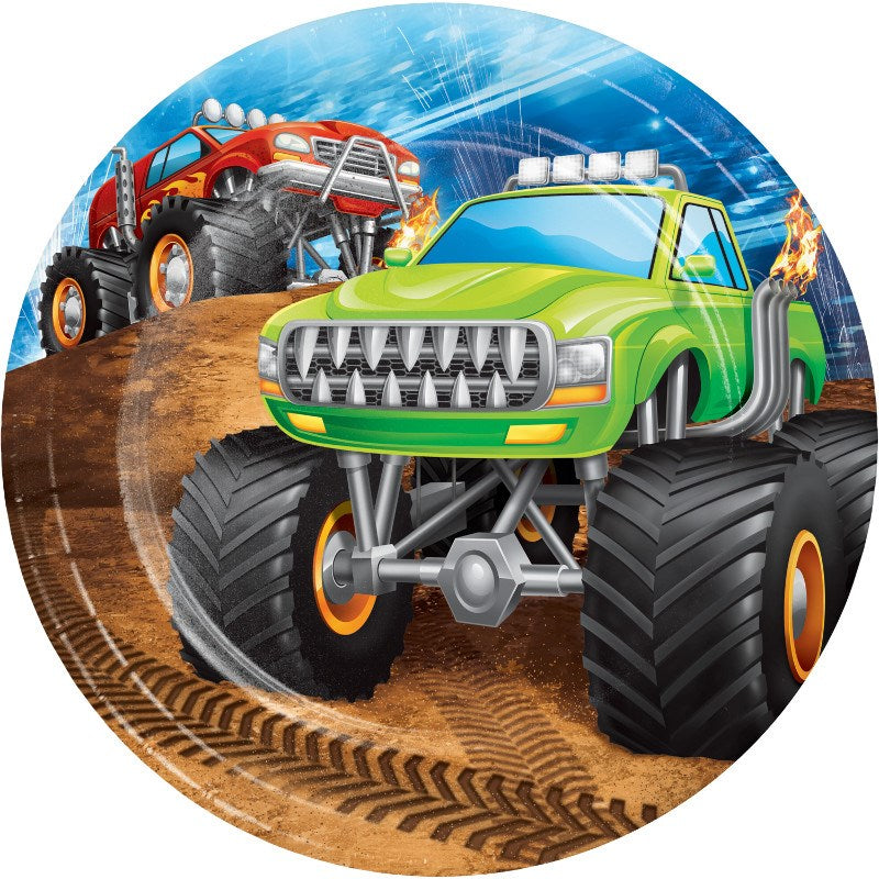 Round plastic plate with green and red monster trucks racing on a dirt track under a blue sky.