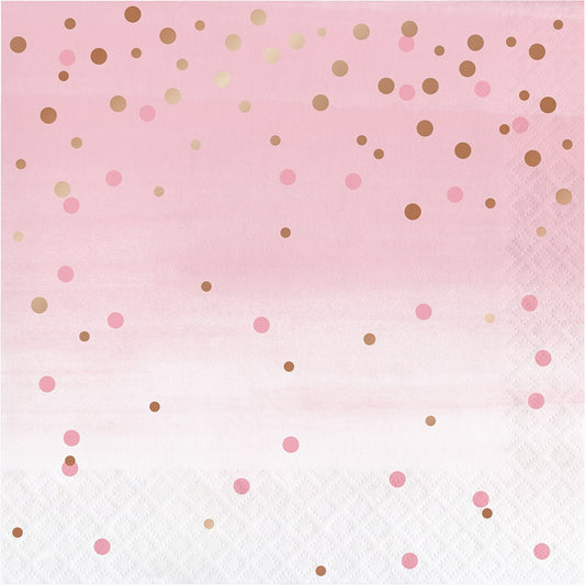 Pink paper napkin with scattered rose gold and light pink polka dots, 16-pack.
