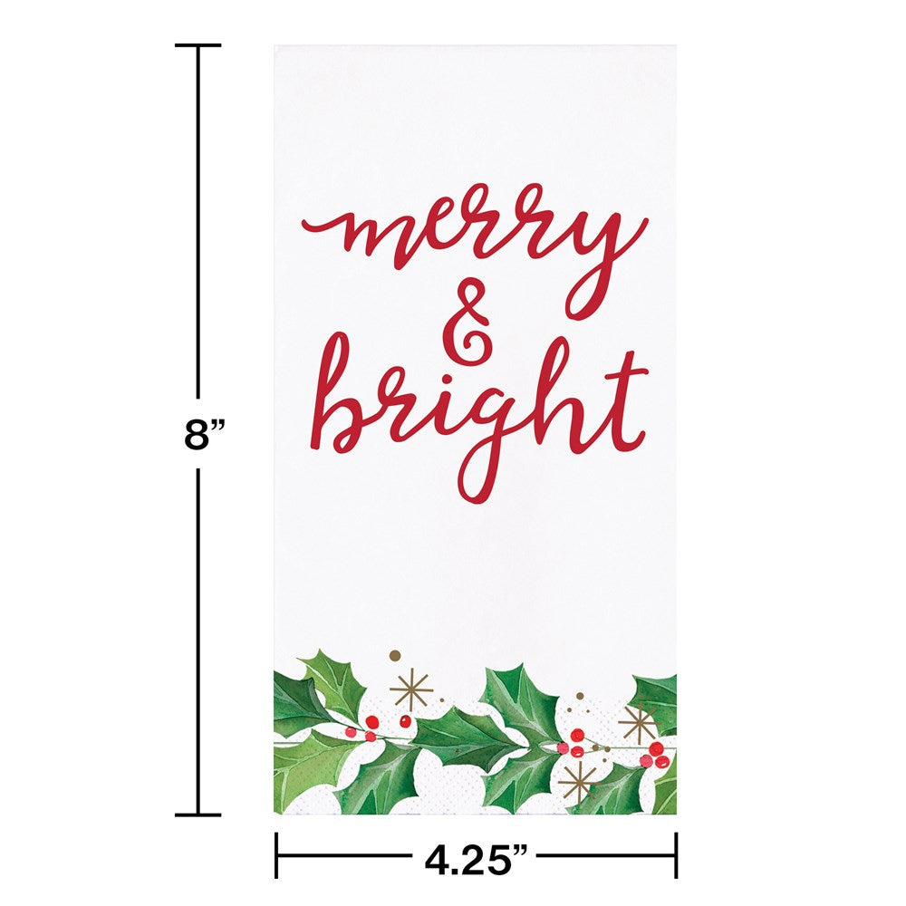 White guest towel with "merry & bright" in red script and holly leaves with red berries at the bottom.