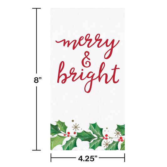 White guest towel with "merry & bright" in red script and holly leaves with red berries at the bottom.