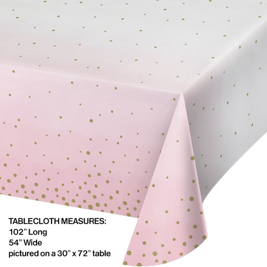 Rectangular pink and white plastic tablecover 54x102 inches with scattered gold polka dots.