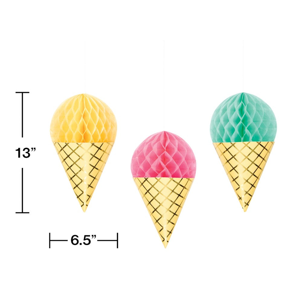 Set of three hanging foil ice cream cones with yellow, pink, and turquoise honeycomb scoops above gold cones.