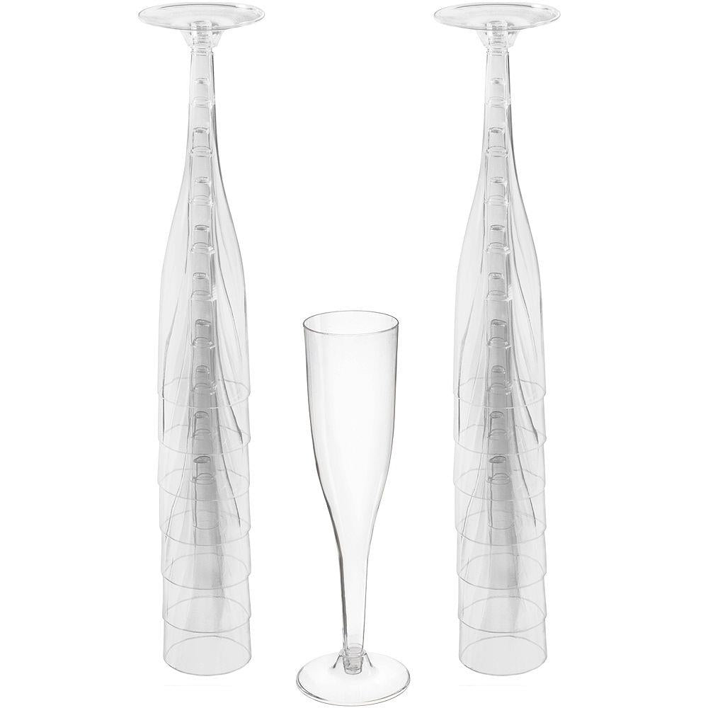 Set of three clear 5.5 oz champagne flutes with slender stems and narrow bowls.