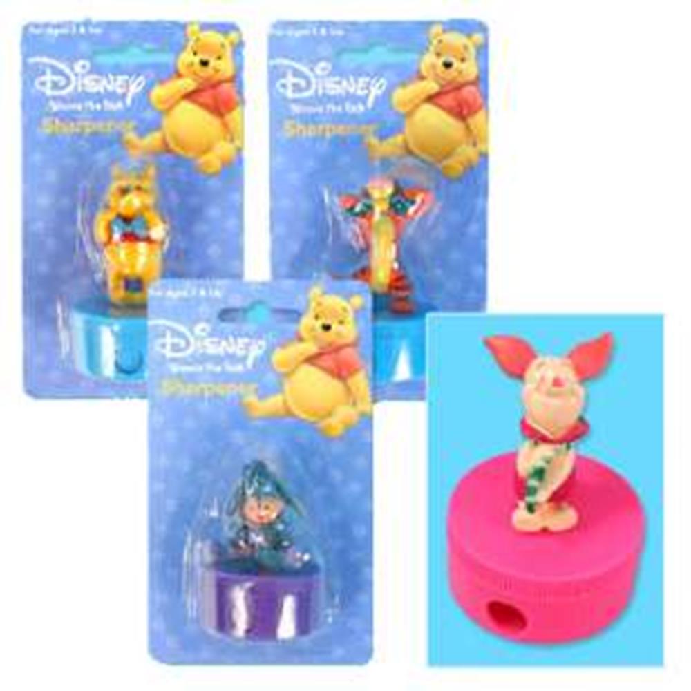 Set of three Disney pencil sharpeners featuring Winnie the Pooh, Tigger, and Piglet figurines on colorful bases.