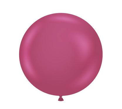 36-inch round latex balloon in shiny deep pink color with a tied end.