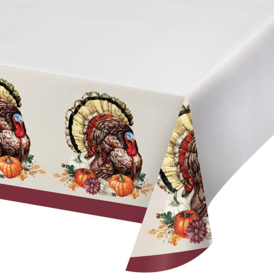 White paper tablecover with vintage turkey border print featuring autumn leaves and pumpkins.