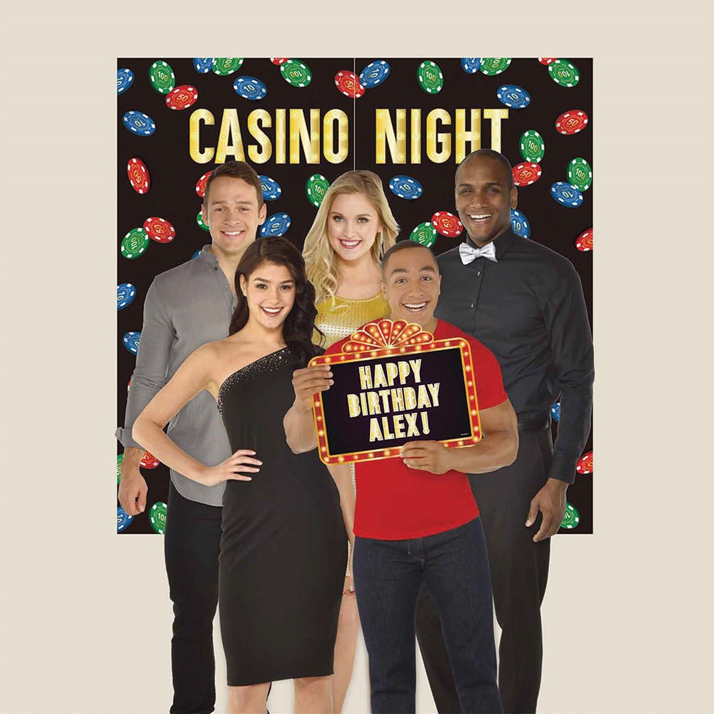 Casino Night backdrop with colorful poker chips and guests holding a Happy Birthday Alex sign.