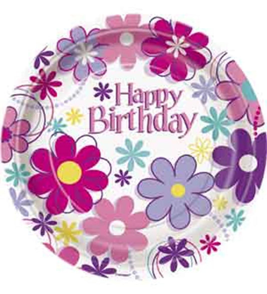 Round paper plate with colorful pink, purple, and blue flowers and "Happy Birthday" text in the center.
