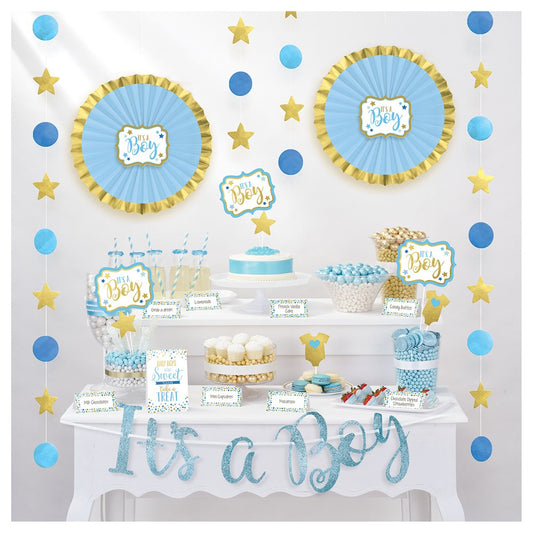 Blue and gold baby shower buffet kit with decorated paper plates, cupcake toppers, popcorn boxes, and "It's a Boy" banner.
