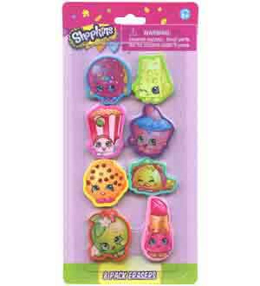 Set of eight colorful Shopkins-themed erasers shaped like cupcake, bag, donut, and lipstick characters in clear plastic.