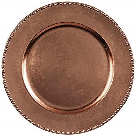 Round metallic rose gold charger plate with a beaded edge detail and smooth center.