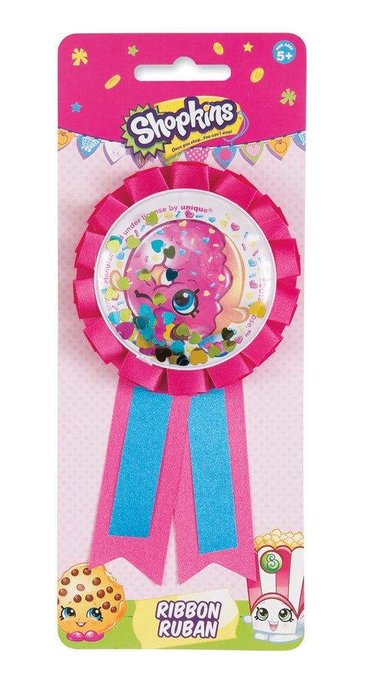 Pink and blue Shopkins award ribbon with colorful character design and scalloped edge in clear packaging.