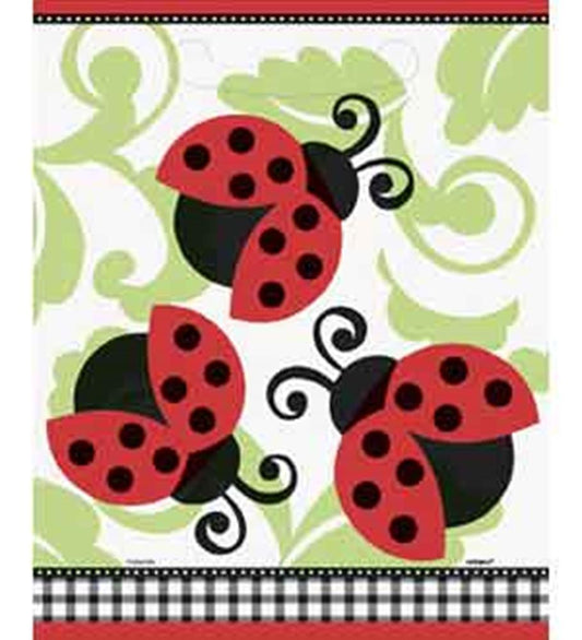 White loot bags decorated with red and black ladybugs and green swirly leaf patterns, 8-pack.
