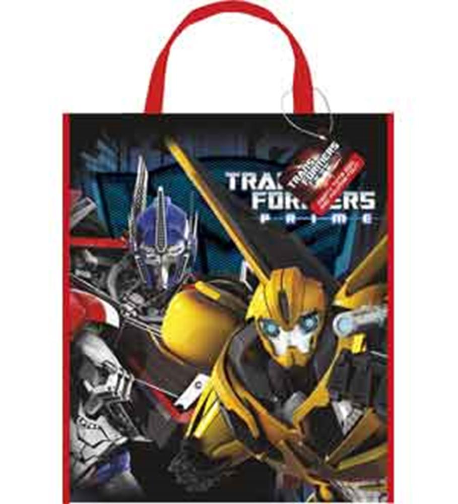 Black rectangular tote bag with red handles featuring yellow and blue Transformers characters and white logo text.