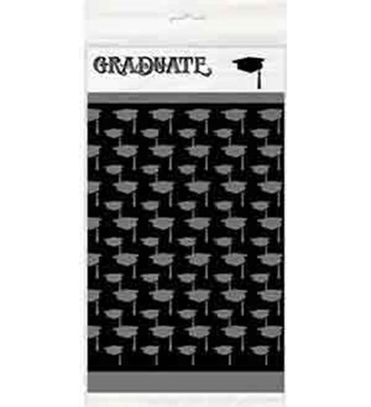 Black and white plastic tablecover with repeating graduation cap pattern and "GRADUATE" text and cap graphic at the top.