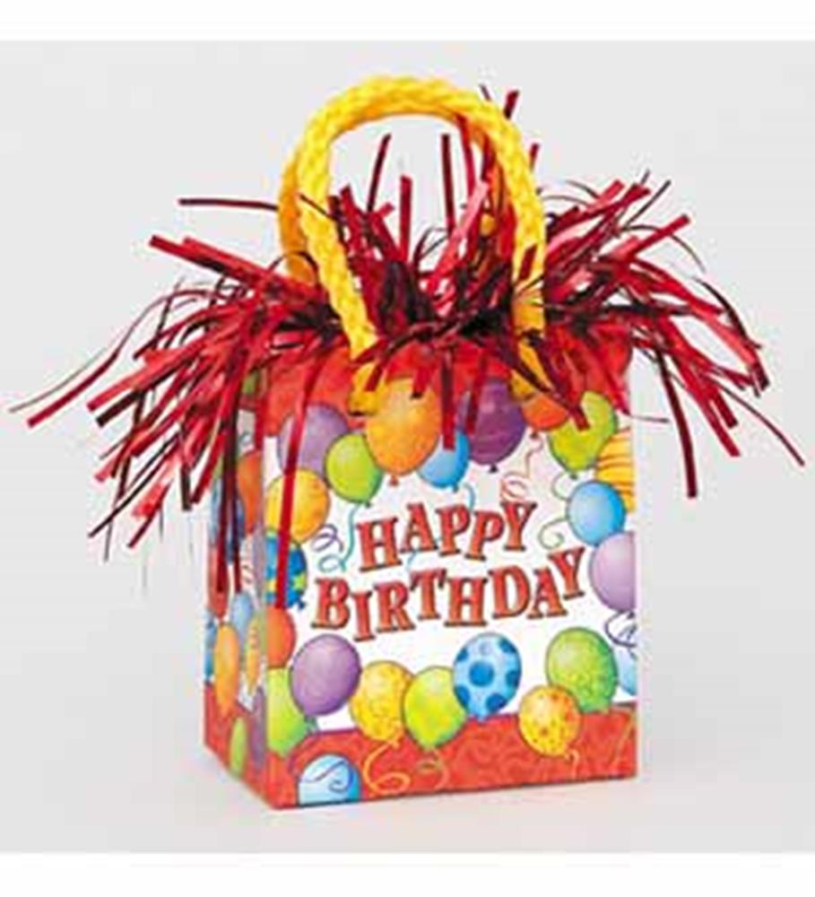 Colorful birthday-themed mini gift bag with balloon graphics, red metallic fringe, and yellow twisted handles.