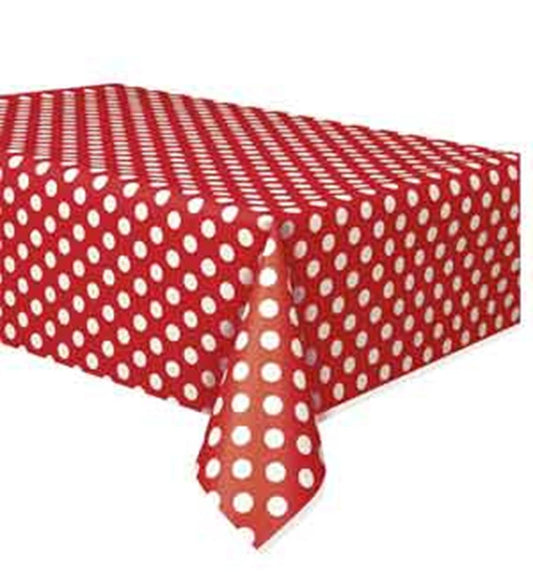 Rectangular plastic table cover in ruby red with evenly spaced white polka dots, 54" x 108".