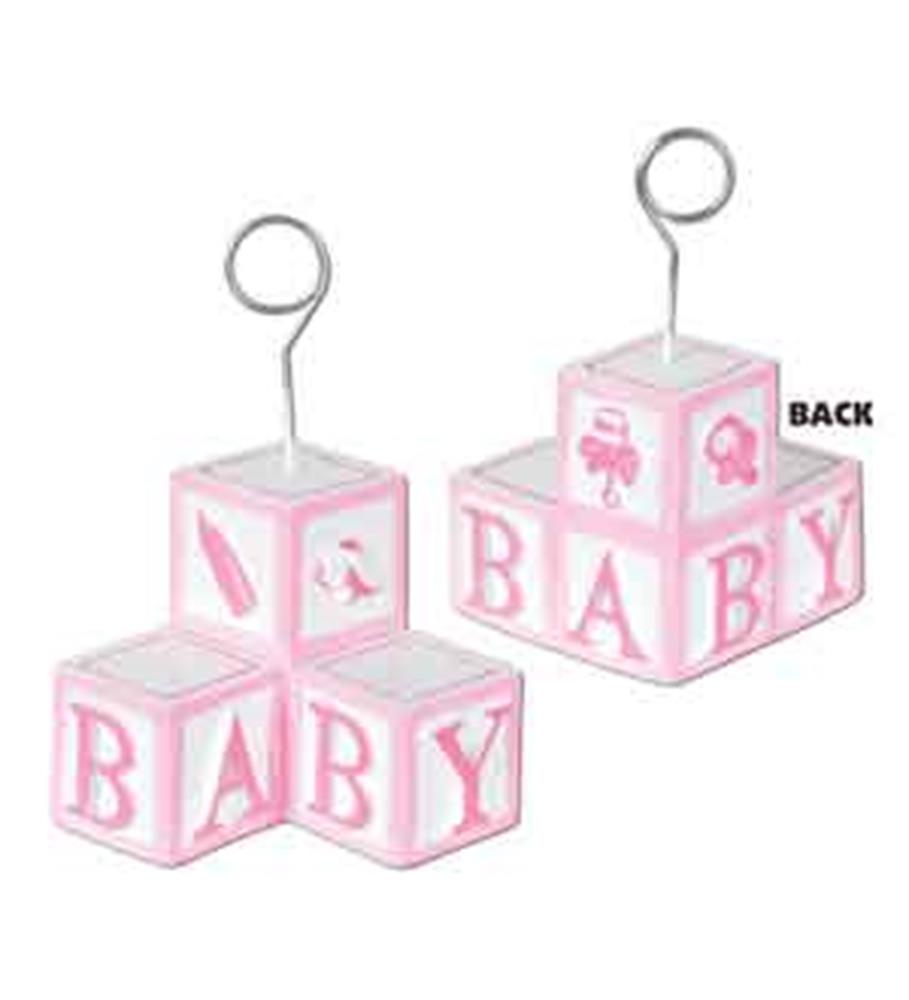 Pink and white baby blocks photo holder with metal loop for displaying pictures or cards.
