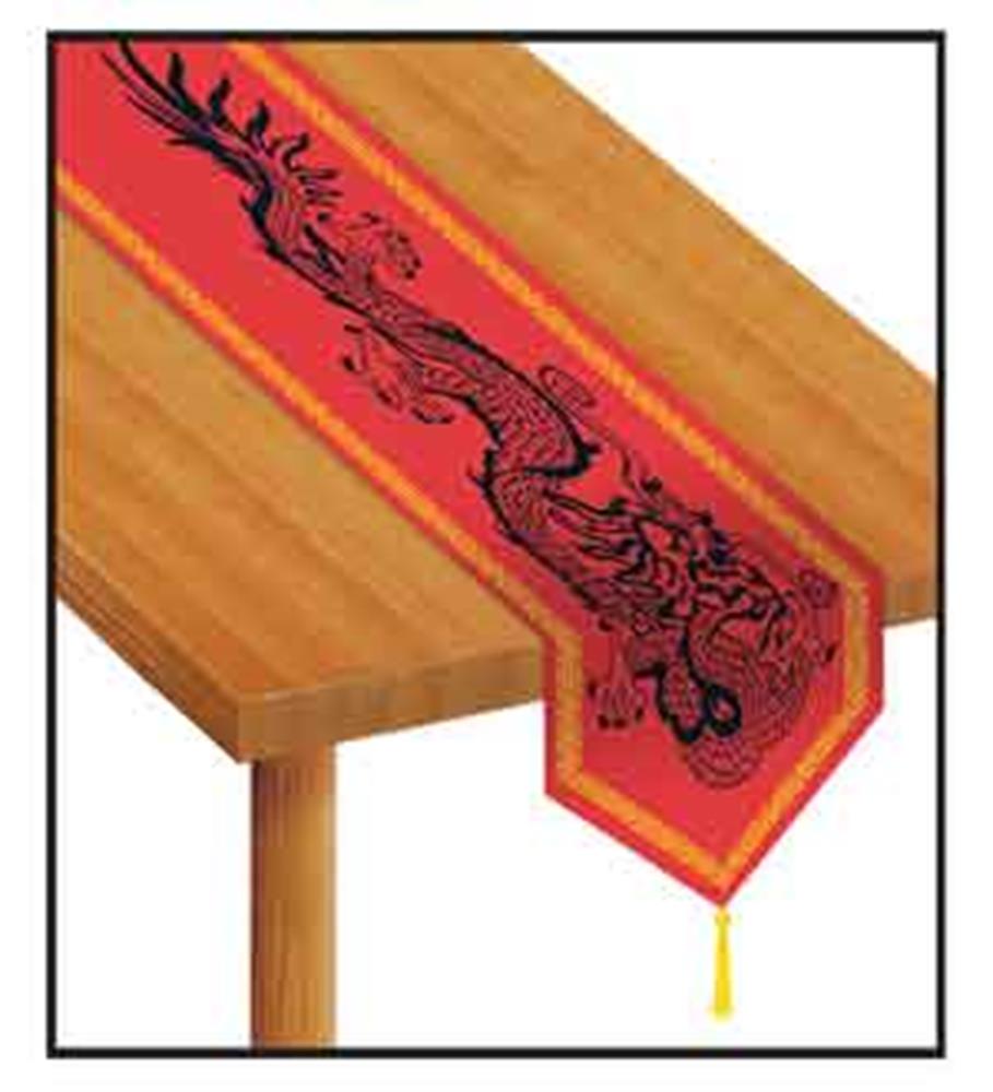 Red fabric table runner with gold trim, featuring a black Chinese dragon design and tassel end.