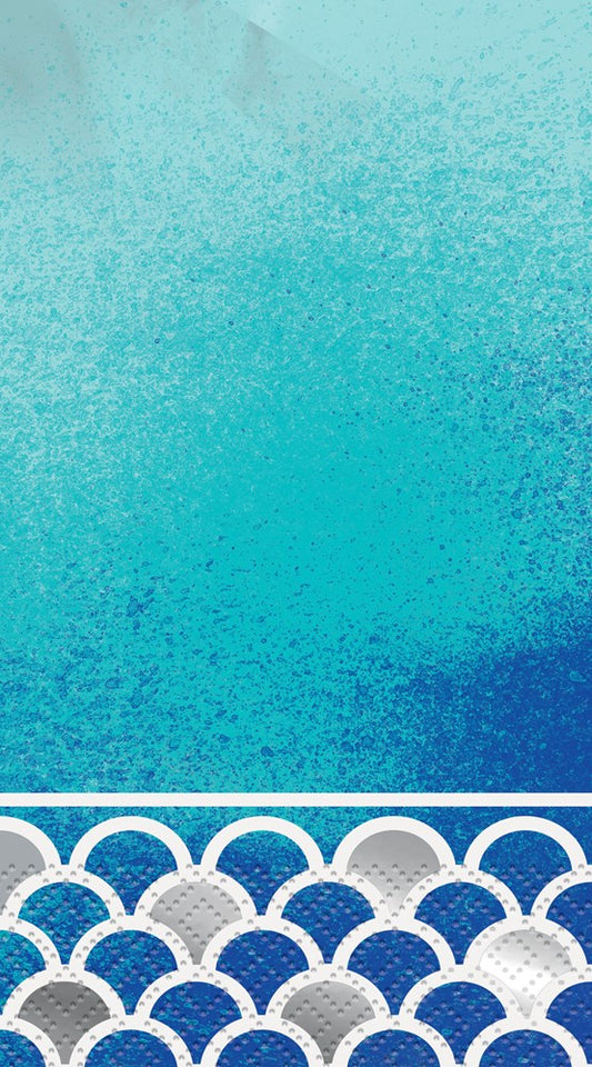 Ocean blue scallop patterned guest napkin with gradient shades and silver accents, 16 count pack.