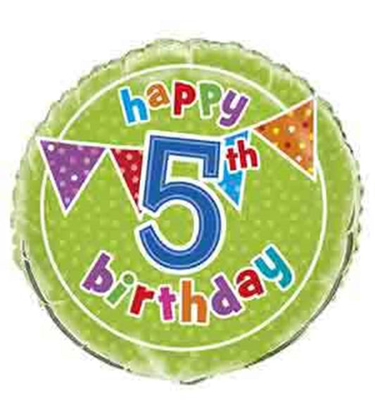 Round green foil balloon with white polka dots, colorful "happy 5th birthday" text, and multicolored pennant flags around.