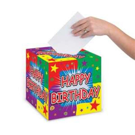 Colorful cube-shaped birthday card box with "Happy Birthday" text and star decorations, hand inserting card.
