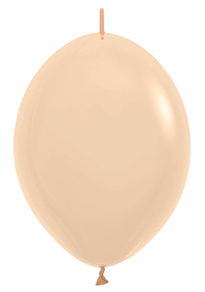 12 inch pastel matte peach latex balloon with a smooth, round shape and tied end.