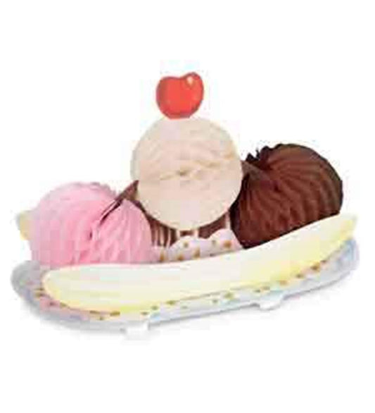 Banana split tissue decoration with pink, white, and brown honeycomb scoops and red cherry topper on white tray.