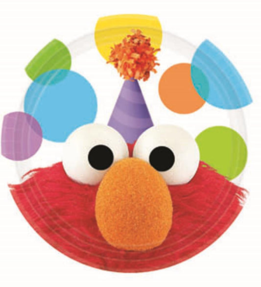 Round paper plate featuring Elmo’s red fur, large white eyes, and orange nose with colorful party hat and confetti accents.