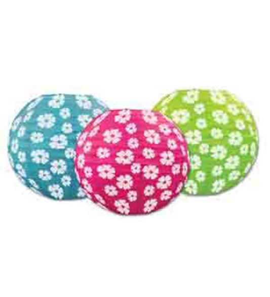 Three round paper lanterns in blue, pink, and green, each decorated with white hibiscus flower patterns.