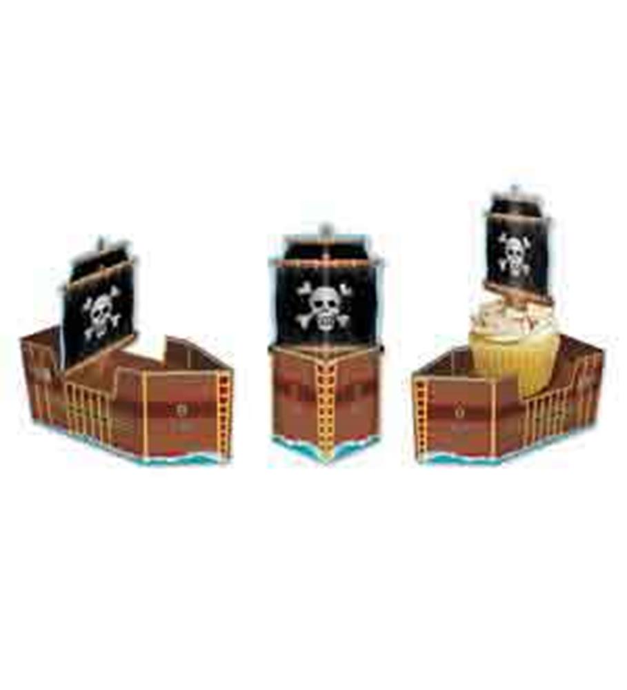 Brown paper pirate ship favor boxes with black sails featuring white skull and crossbones designs.