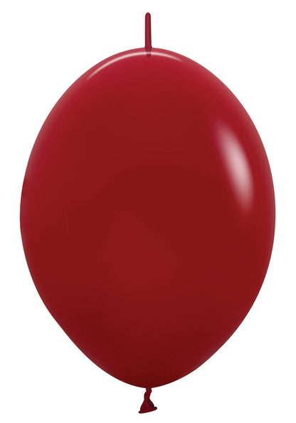 Glossy 6-inch round red latex balloon with tied neck and smooth surface.