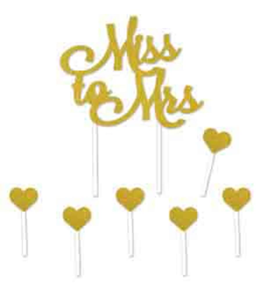 Gold glitter "Miss to Mrs" cake topper with elegant script and additional gold heart picks on white sticks.