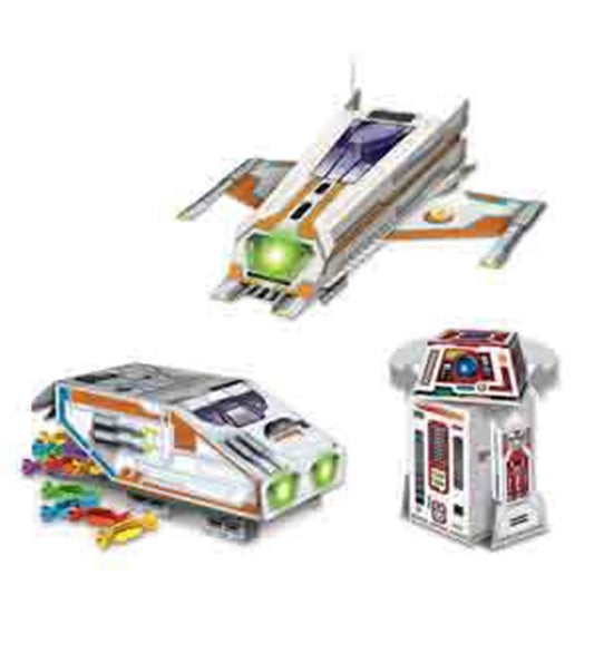 Three space-themed plastic birthday decorations including a white spaceship with orange accents, a rectangular shuttle with.