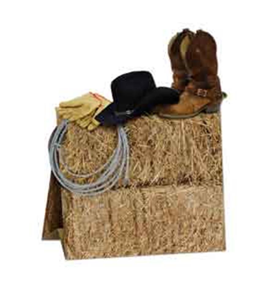 Western-themed table centerpiece with stacked hay bales, cowboy boots, black hat, gloves, and coiled rope decoration.