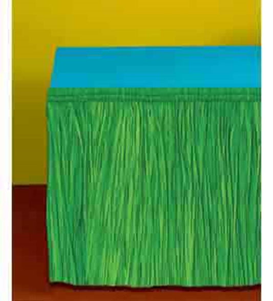 Green paper table fringe with a textured, grass-like appearance and blue tabletop cover.