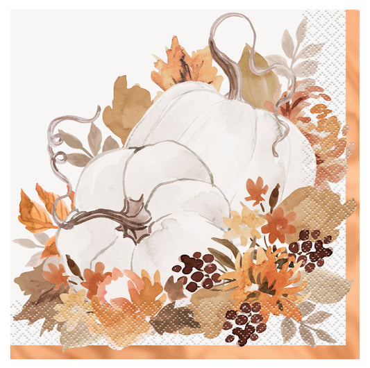 White napkin with hand-drawn white pumpkins surrounded by autumn leaves, berries, and a plaid border.