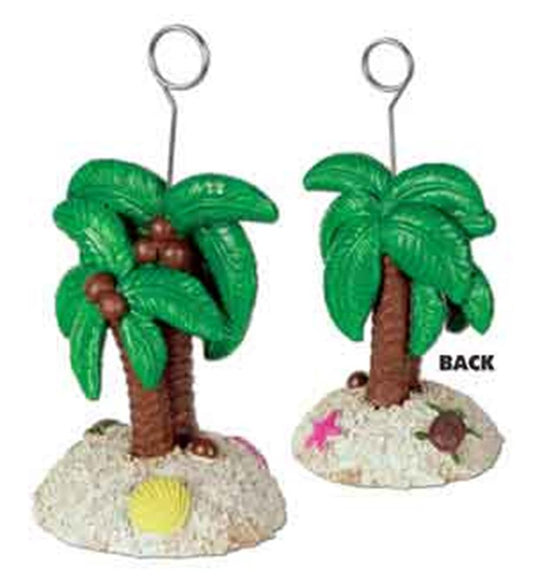 Green palm tree photo holders with brown trunks, coconuts, and sandy bases decorated with seashells and starfish.