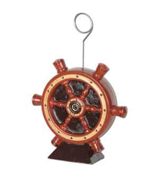 Wooden nautical ship helm photo holder with dark brown spokes and metal clip on base.